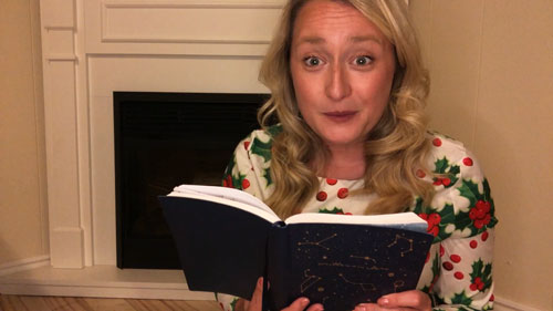 Image of the storyteller telling the story of 'Twas the Night Before Christmas.