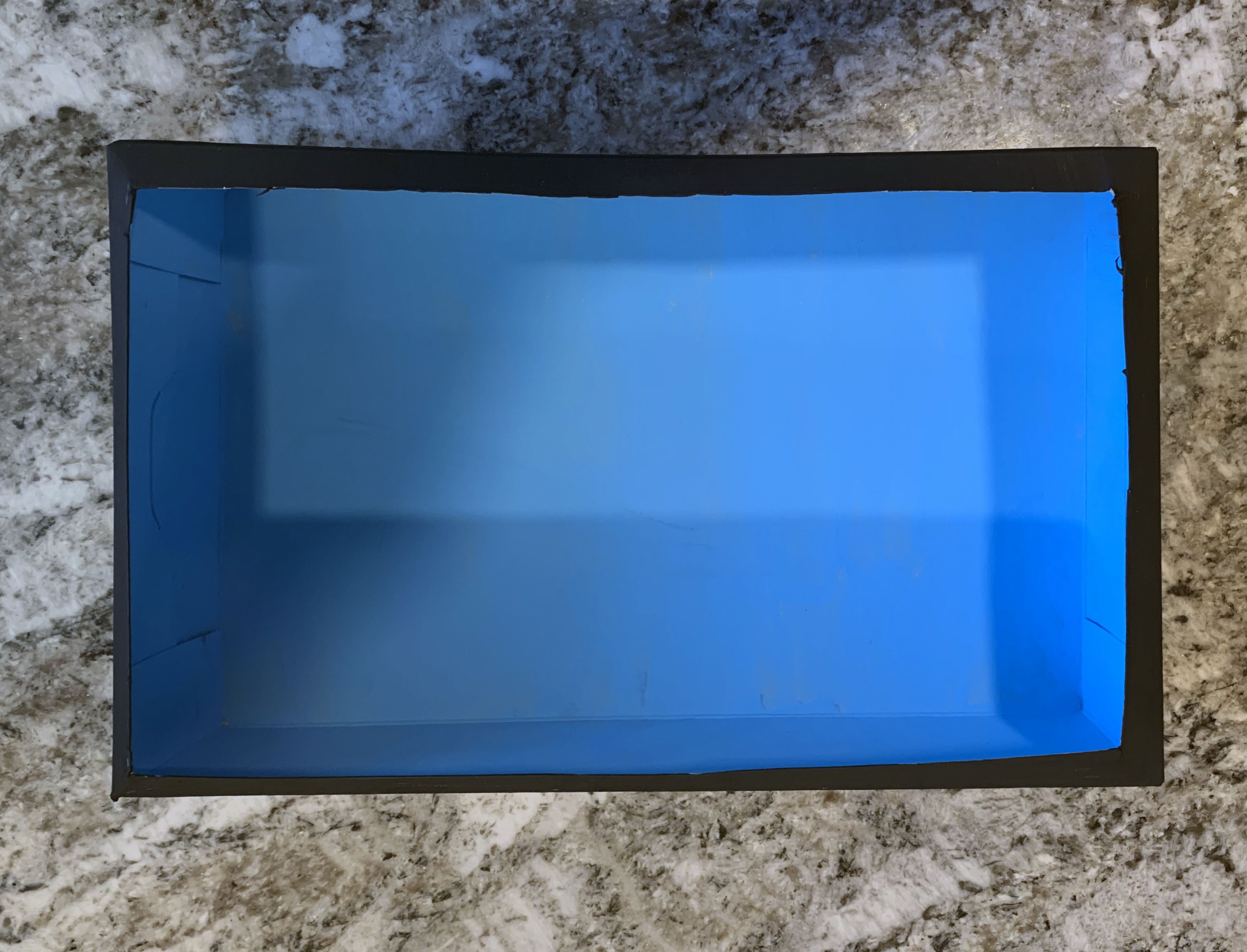 Paint the box blue inside and black outside