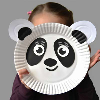 Paper Plate Panda Craft held by a child