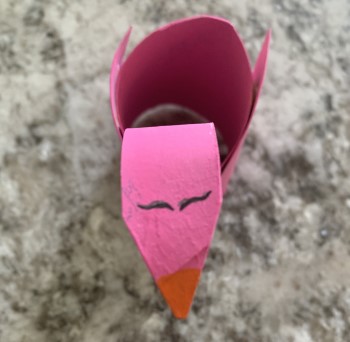 Add eyes and beak with a marker or bit of paint.