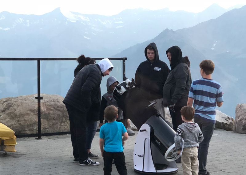 Everyone takes a turn at the telescope.