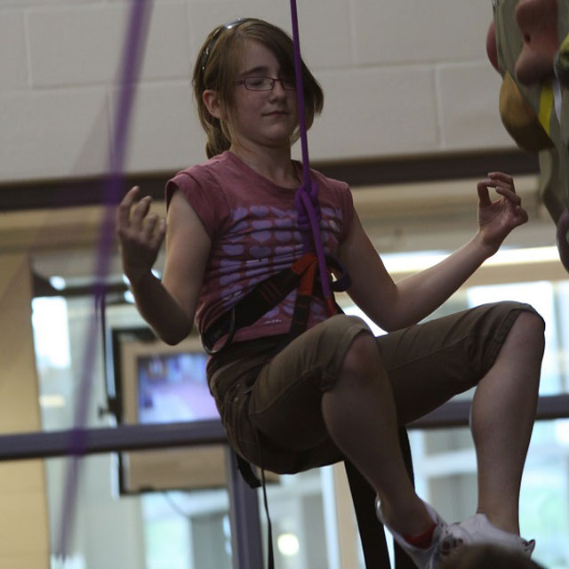 Extroverts and Introverts: Kaitlyn rock climbing