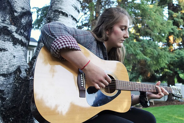 Extroverts and Introverts: Kaitlyn playing guitar