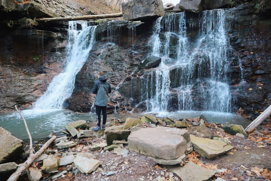 Man standing in front of Waterfall in Ontario