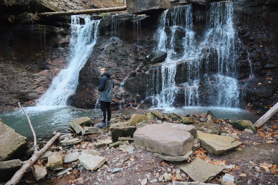Man standing in front of Waterfall in Ontario